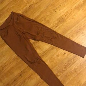Rust colored “distressed” jeggings with pockets